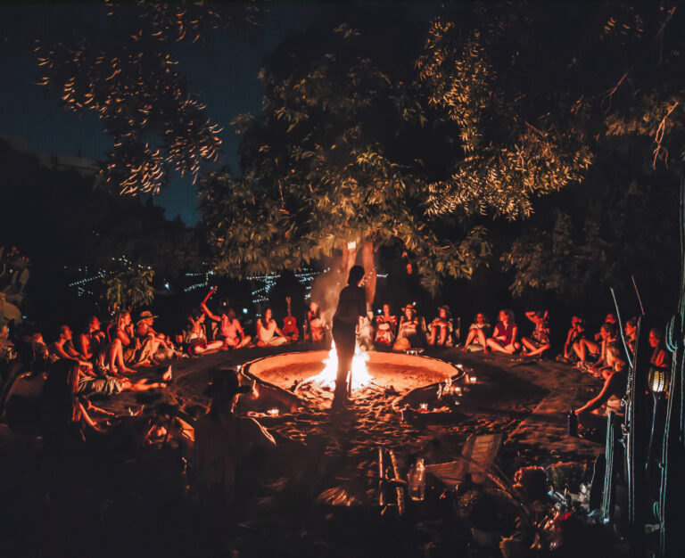 A large ceremonial gathering around fire